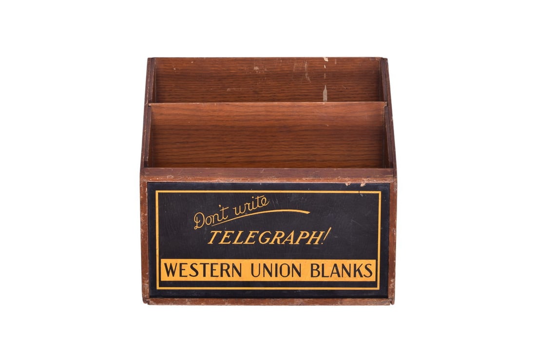9 1/4" by 9 1/8" by 3" wooden holder with Don't Write, Telegraph! Western Union Blanks across the: 9 1/4" by 9 1/8" by 3" wooden holder with Don't Write, Telegraph! Western Union Blanks across the front. There's two small chips out of the front sign, some loss of the wooden inserts at both ends of 