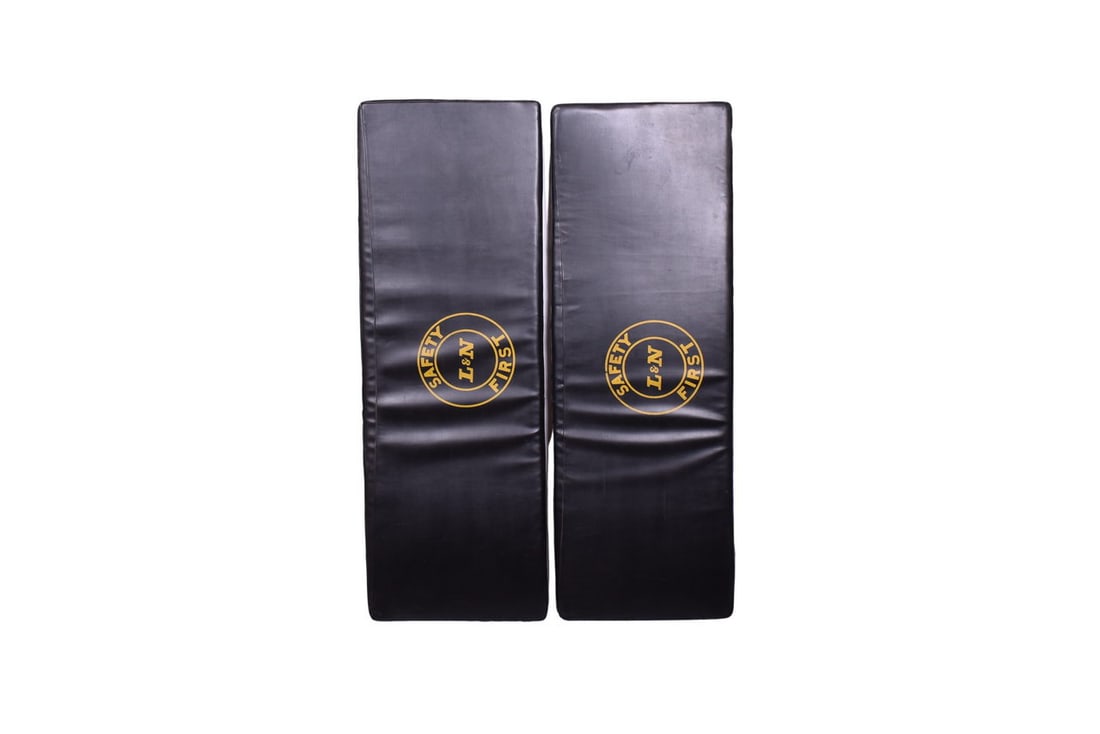 Two approximately 76" by 26" by 3" thick cot mattresses, each with a yellow L&N Safety First (1 of 5)