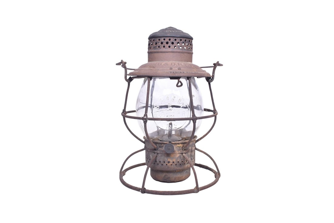 Adams & Westlake "The Adams" brass top lantern with B&O RR and LOCO embossed on the: Adams & Westlake "The Adams" brass top lantern with B&O RR and LOCO embossed on the shoulder. Latest patent date reads Jan. 26 1909. The lantern is unrestored with an even coat of rust. There 