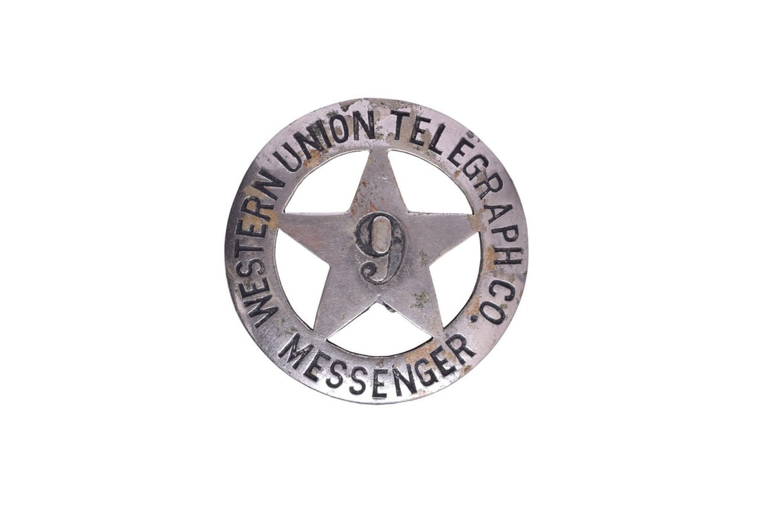 A 1 7/8" metal Western Union Telegraph Co. Messenger badge with the number 9 in the middle. Badge (1 of 3)