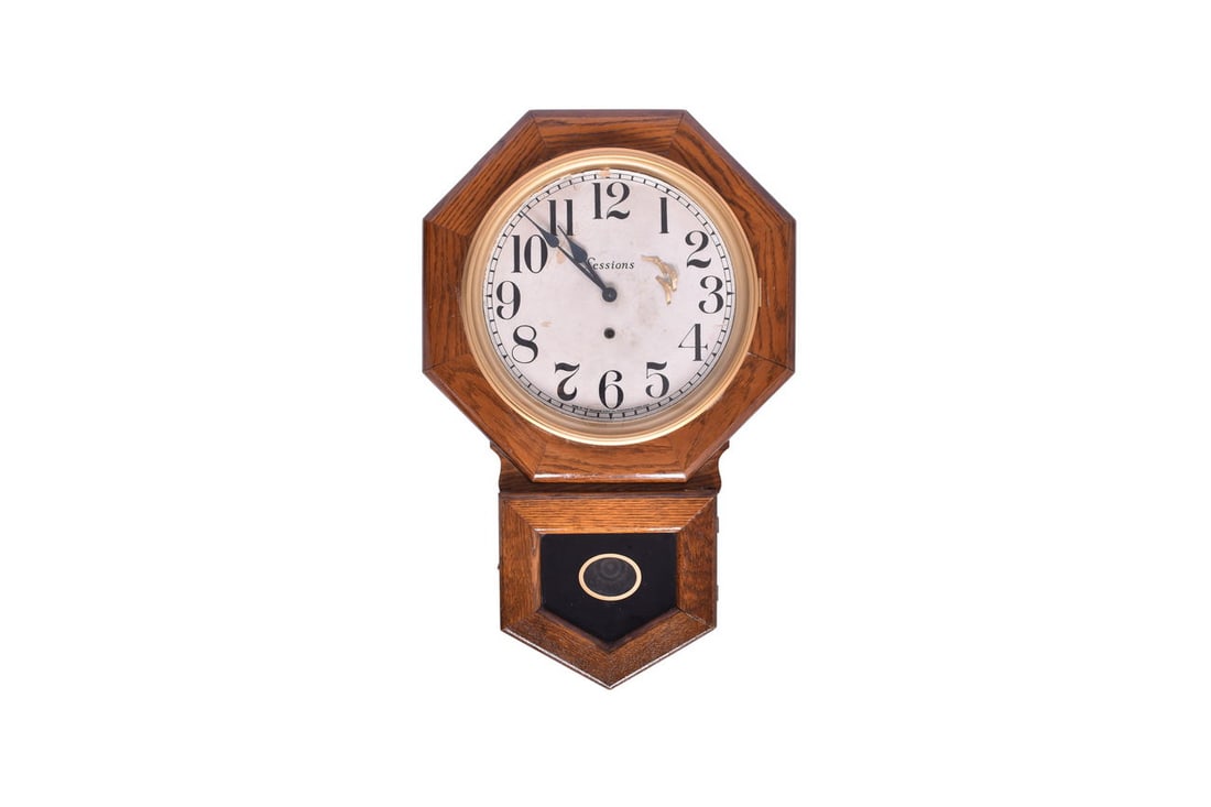 26 3/4" by 17 1/4" by 4 3/8" wooden clock with Sessions printed across the face. The door over the (1 of 10)