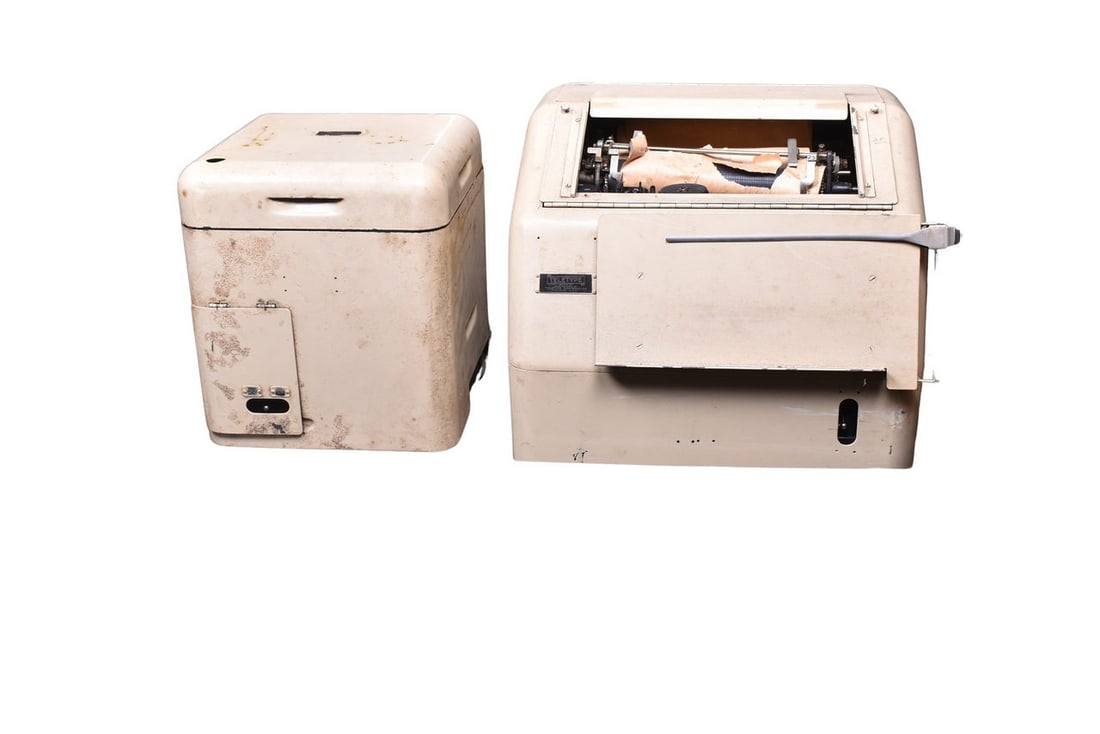 An alphanumeric printing telegraph machine and a single magnet reperforator machine, both with full (1 of 9)