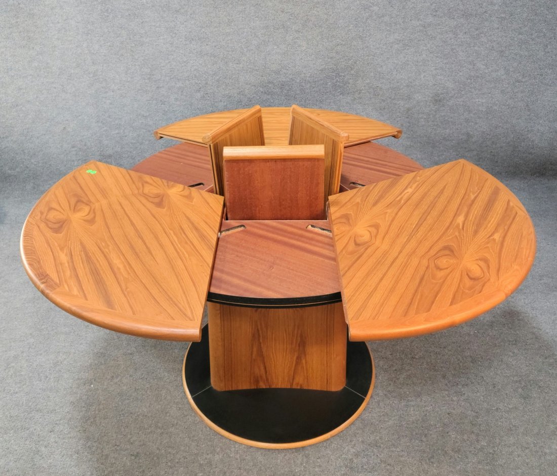 Skovby Dining Room Table (Number 33.): Made in Denmark, This table is in mint condition with a unique mechanism that opens the table with 3 extra boards.--------29h, 47.5 diameter----with leaves 57.5 diameter