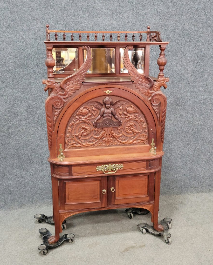 A Horner Bros. Carved Desk: 63"H, 36"W, 18.50"D
