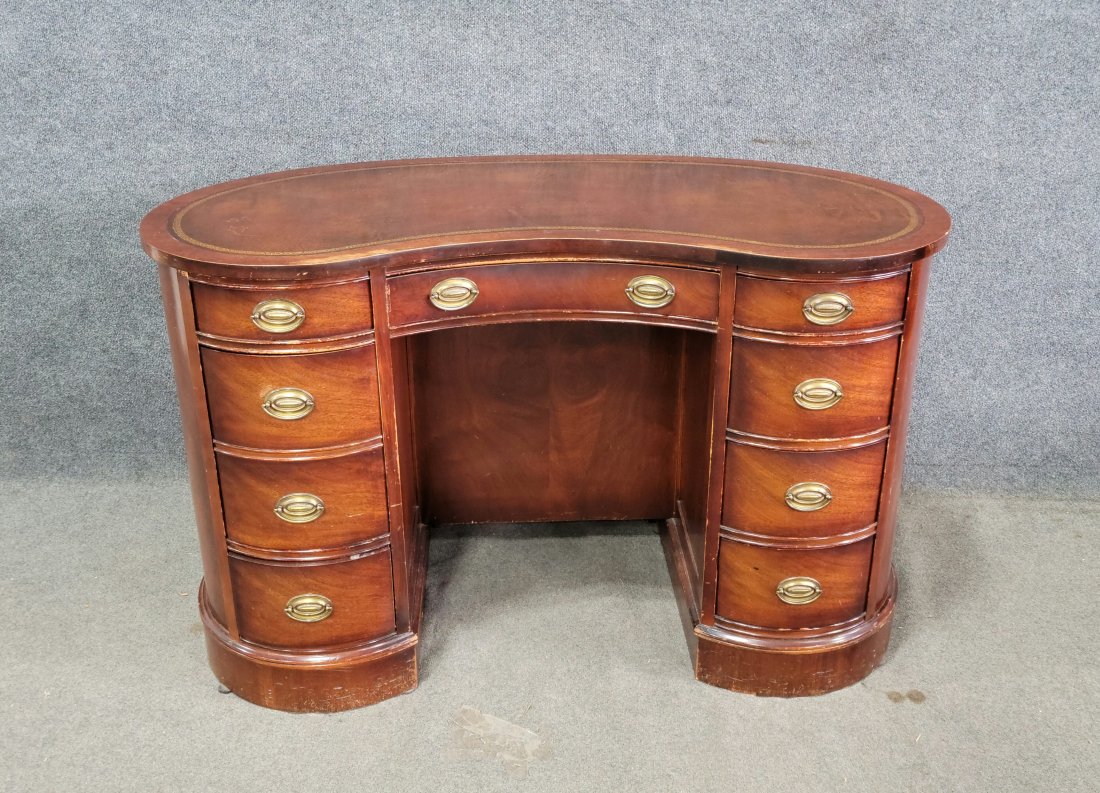 Kidney Shaped Leather Top Desk (Bookcase In The Back): 30"H, 48"W, 22"D