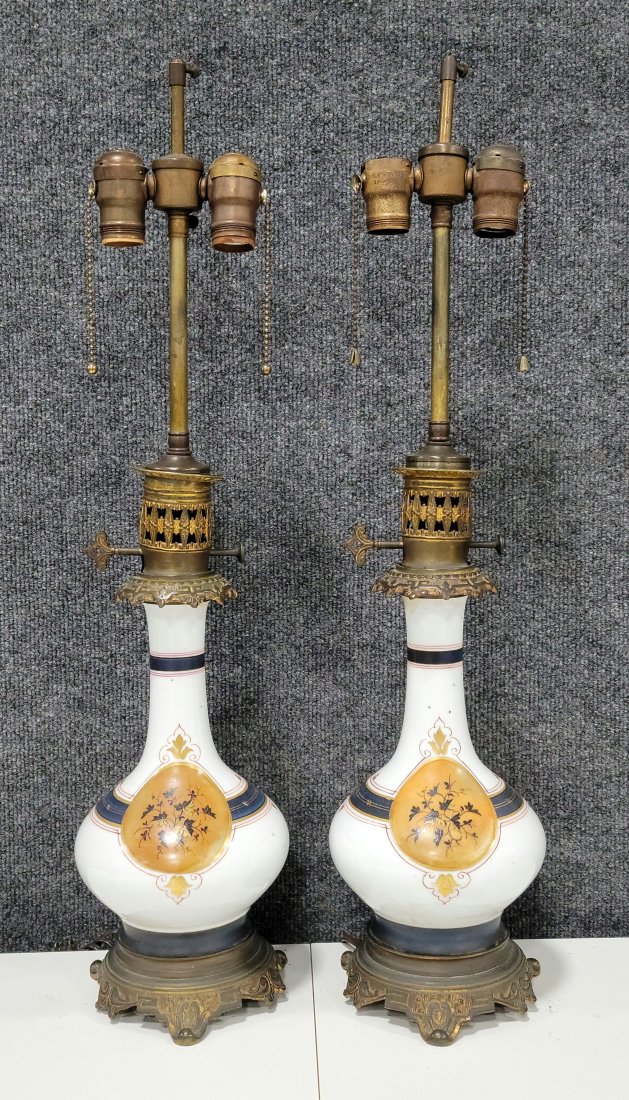 Pair Of Victorian Lamps: Notice to bidders: The absence of a condition report does not imply that the lot is in perfect condition. Complete condition information is available by request. All lots are offered and sold "as is",