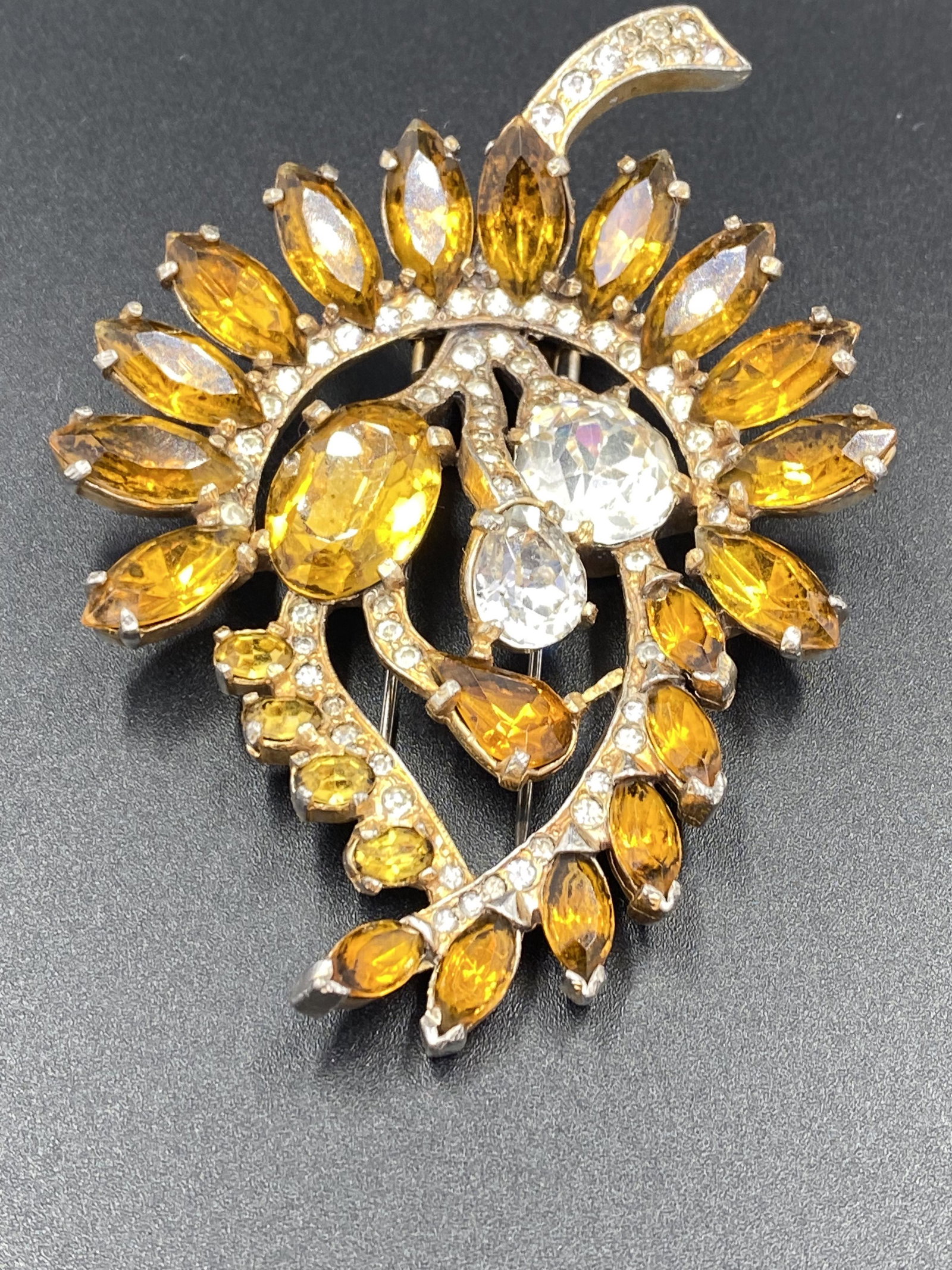 Eisenberg Original Fur Clip with faceted crystals: Eisenberg Original Giant Brooch. For exact dimensions please refer to the attached dimensions sheet. Marked Eisenberg Original. The Eisenberg company has made jewelry for over eight decades, from the 