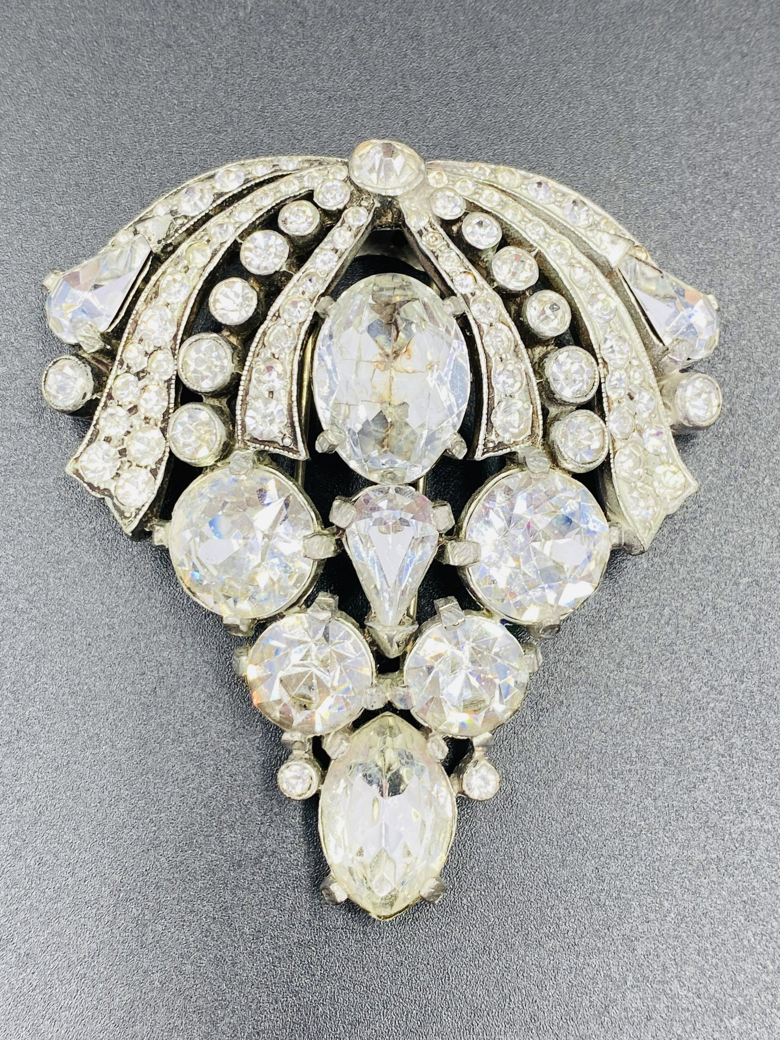 Eisenberg Original Fur Clip with faceted crystals: Eisenberg Original Giant Brooch. For exact dimensions please refer to the attached dimensions sheet. Marked Eisenberg Original. The Eisenberg company has made jewelry for over eight decades, from the 