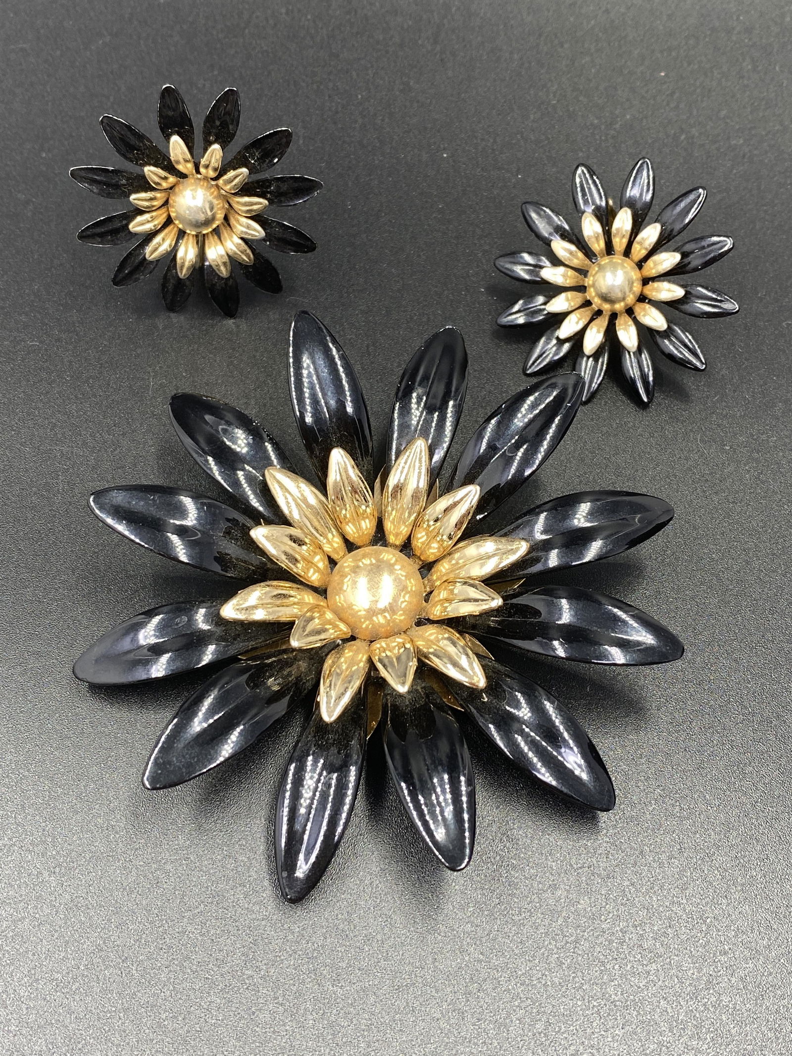 Sarah Coventry Brooch and Earrings: For exact dimensions please refer to the attached dimensions sheet. Marked SarahCov.Founded in 1949 by Charles Stuart, Sarah Coventry was named via the combination of his granddaughterâ€™s first