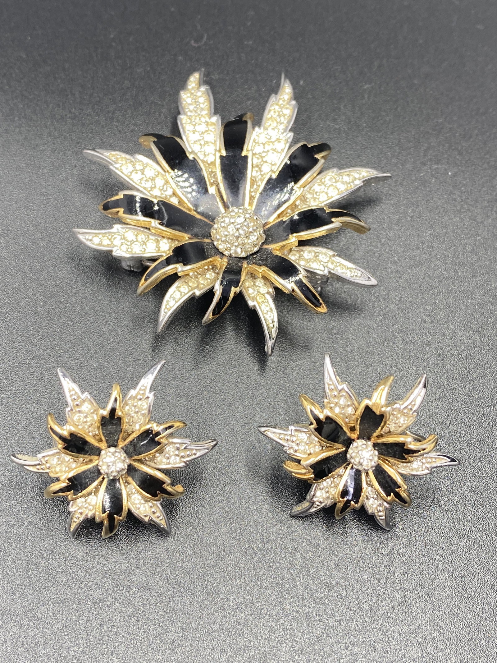 Sarah Coventry Brooch and Earrings: For exact dimensions please refer to the attached dimensions sheet. Marked SarahCov.Founded in 1949 by Charles Stuart, Sarah Coventry was named via the combination of his granddaughterâ€™s first