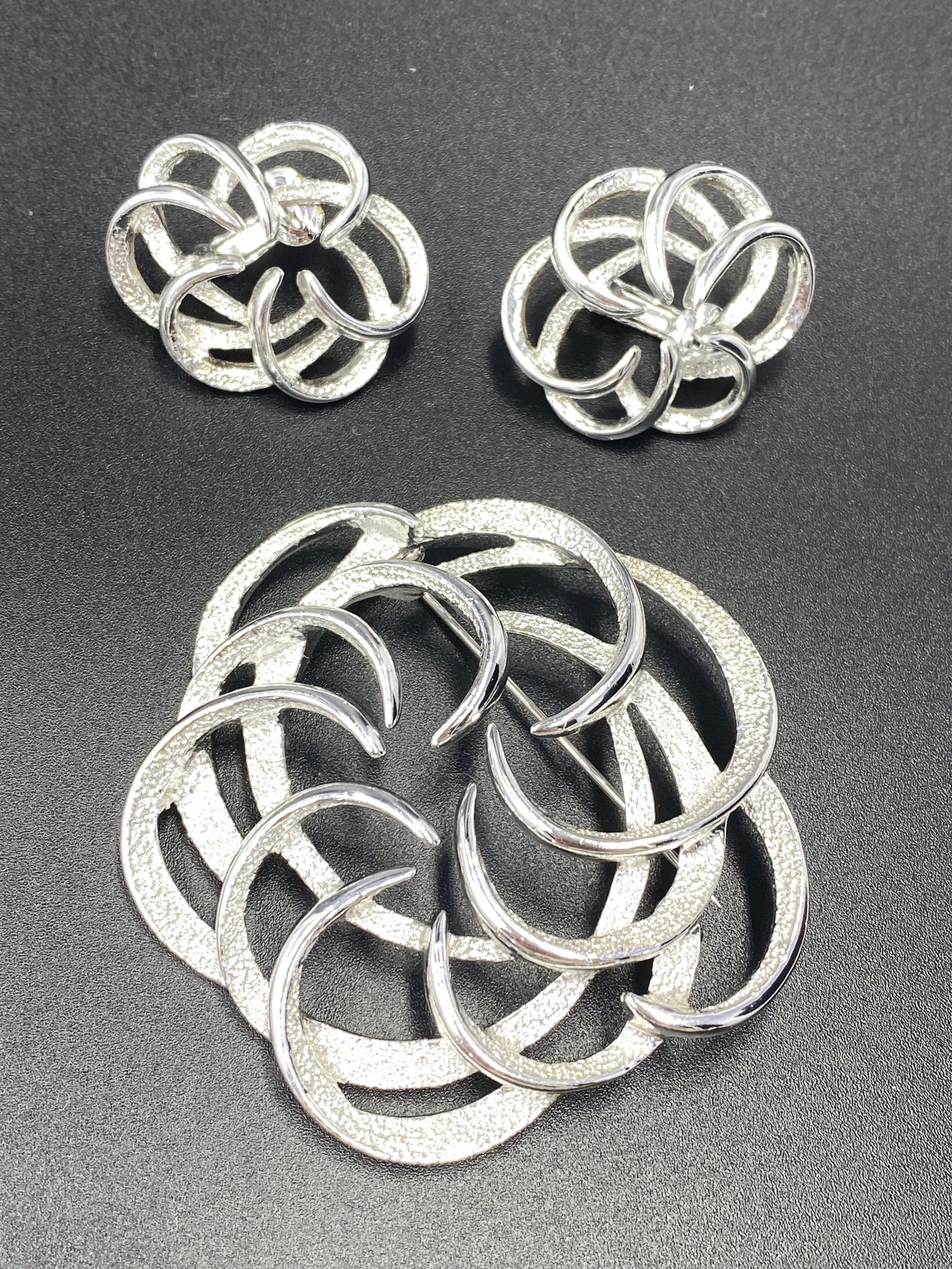 Sarah Coventry Brooch and Earrings: For exact dimensions please refer to the attached dimensions sheet. Marked SarahCov.Founded in 1949 by Charles Stuart, Sarah Coventry was named via the combination of his granddaughterâ€™s first