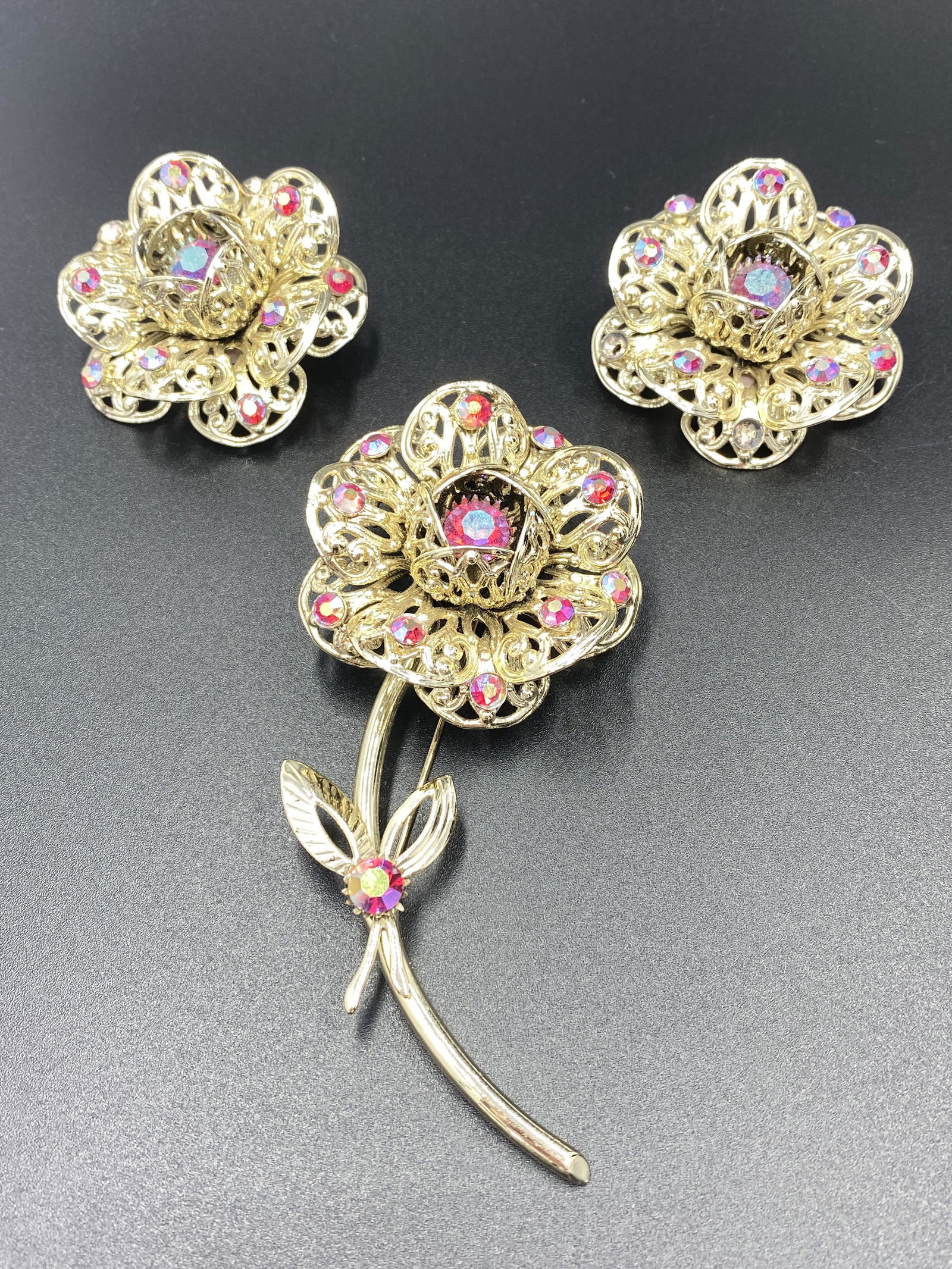 Sarah Coventry Brooch and Earrings: For exact dimensions please refer to the attached dimensions sheet. Marked SarahCov.Founded in 1949 by Charles Stuart, Sarah Coventry was named via the combination of his granddaughterâ€™s first