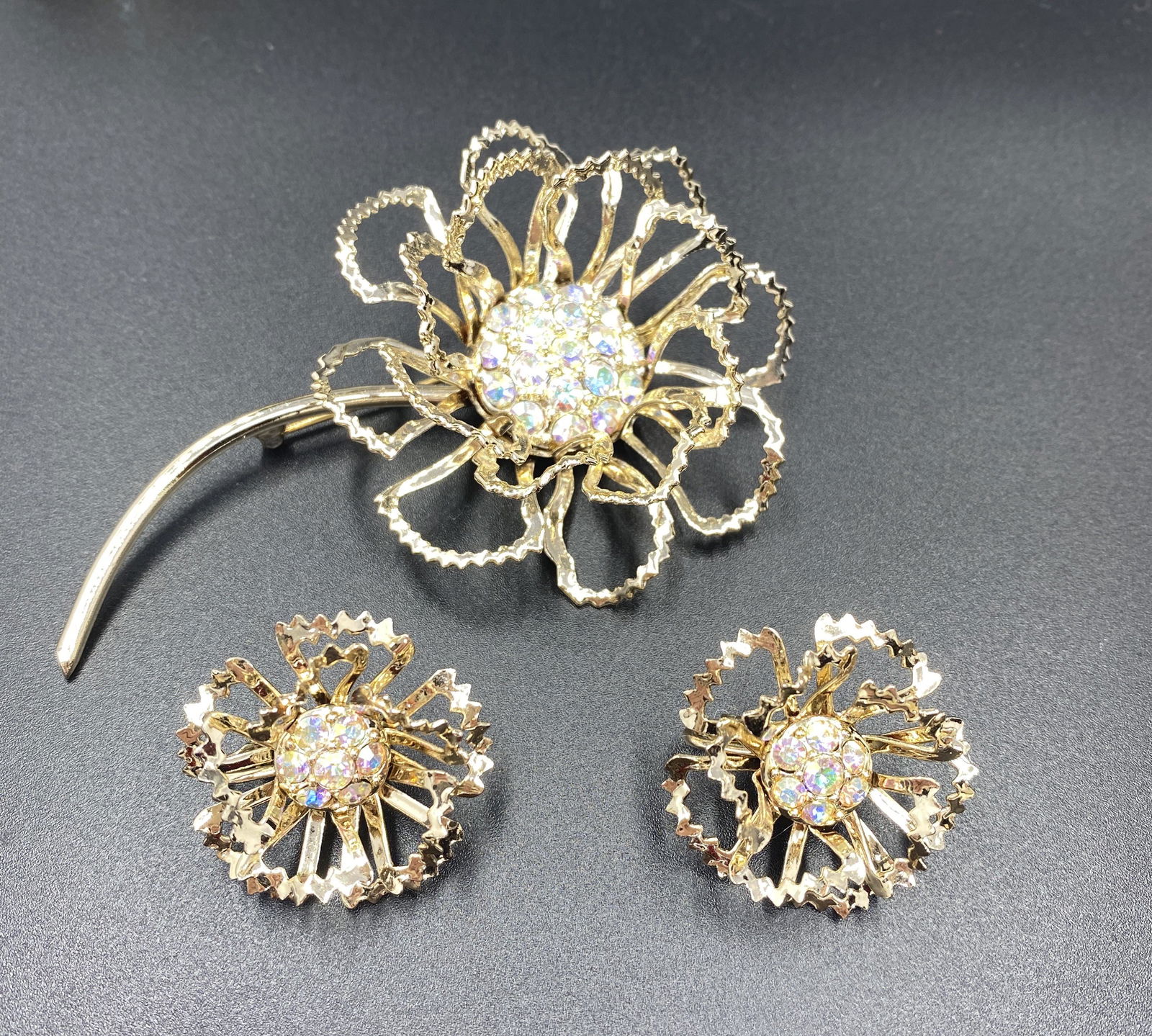 Sarah Coventry Brooch and Earrings: For exact dimensions please refer to the attached dimensions sheet. Marked SarahCov.Founded in 1949 by Charles Stuart, Sarah Coventry was named via the combination of his granddaughterâ€™s first