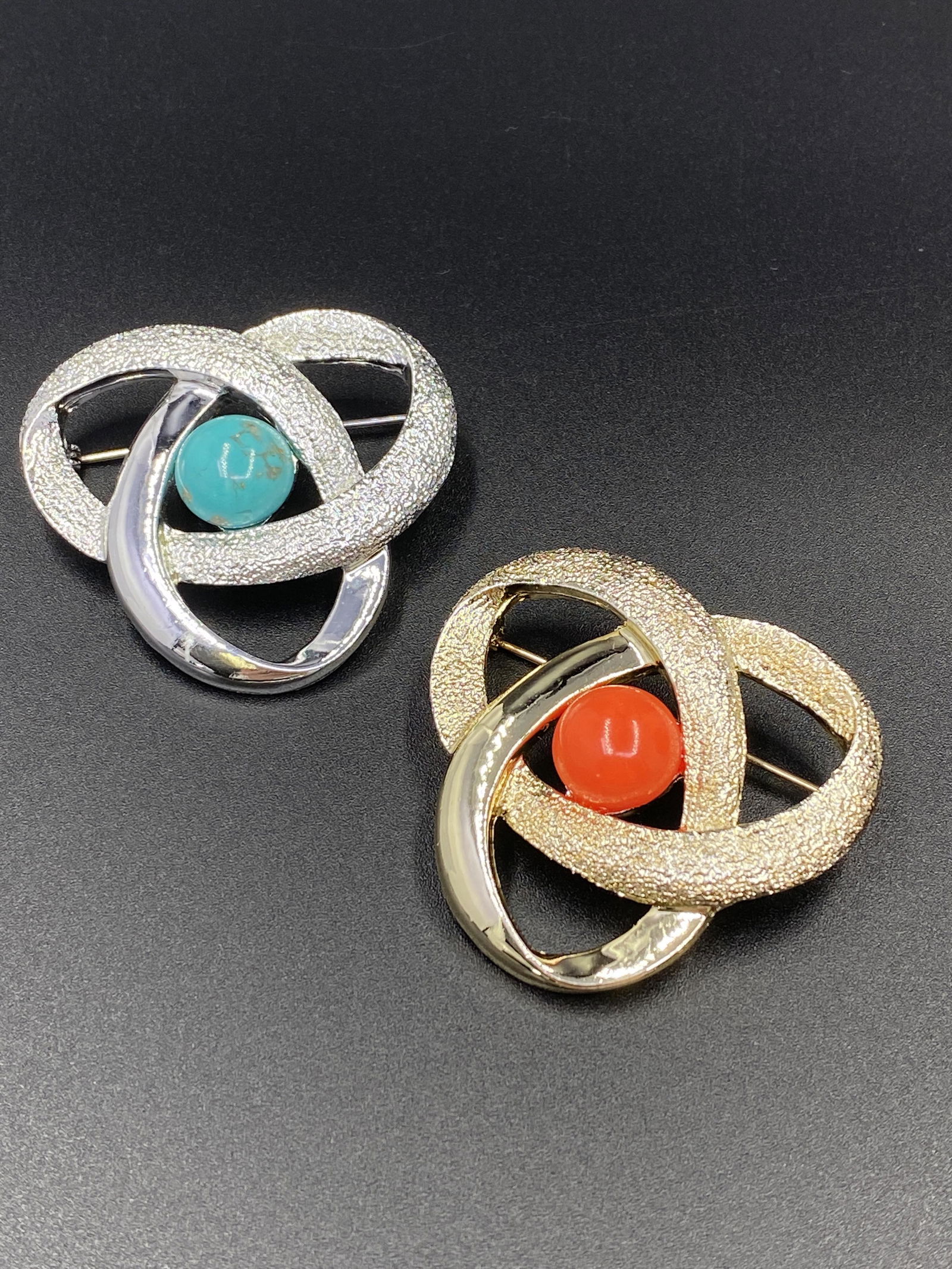 Two Sarah Coventry Brooches: For exact dimensions please refer to the attached dimensions sheet. Marked SarahCov.Founded in 1949 by Charles Stuart, Sarah Coventry was named via the combination of his granddaughterâ€™s first