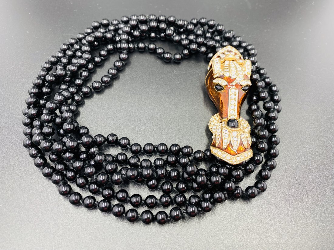 Horse Necklace: Unsigned. For exact dimensions please refer to the attached dimensions sheet. Innovative, gifted, and imaginative, Kenneth Jay Lane's exceptional skill has ensured him a permanent place in fashion his