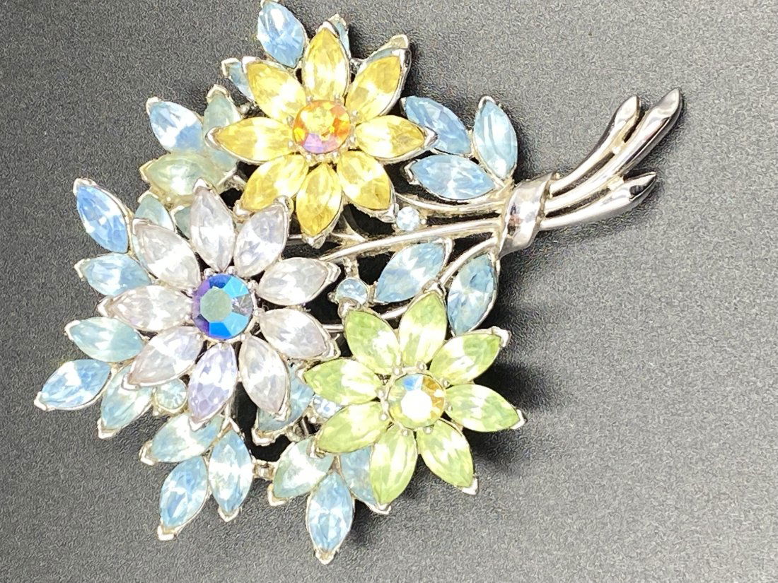 Vintage 11960s Trifari Flower Bouquet Brooch: For exact dimensions please refer to the attached dimensions sheet. Marked TrifariTRIFARI is one of the brightest stars of all the costume jewelry makers, beginning as Trifari, Krussman & Fishel in th
