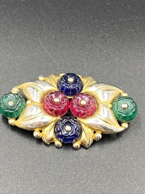 1940s Trifari Alfred Philippe Fruit Salad Brooch: For exact dimensions please refer to the attached dimensions sheet. Marked TrifariTRIFARI is one of the brightest stars of all the costume jewelry makers, beginning as Trifari, Krussman & Fishel in th
