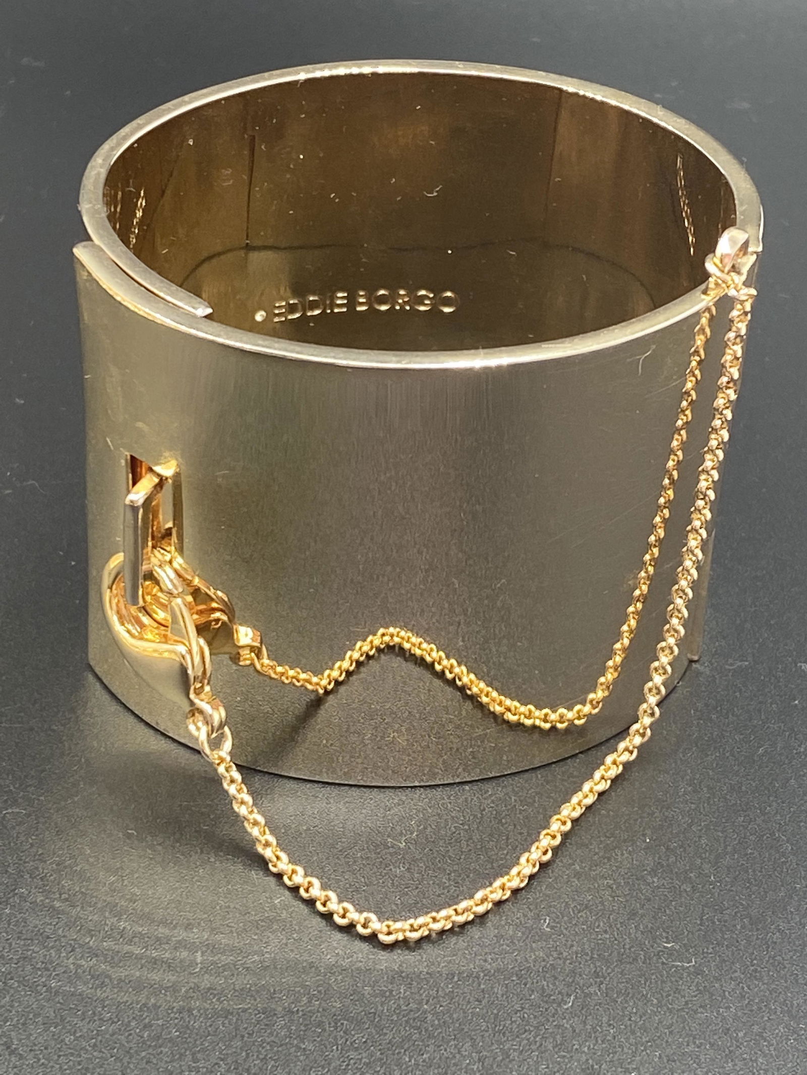 Eddie Borgo Wide Safety Chain Cuff: For exact dimensions please refer to the attached dimensions sheet. Marked Eddie Borgo. INSPIRED BY SHAPES AND SYMBOLS ASSOCIATED WITH ADORNMENT, MODERN ART AND ARCHITECTURE, EDDIE BORGO CREATES COLLE
