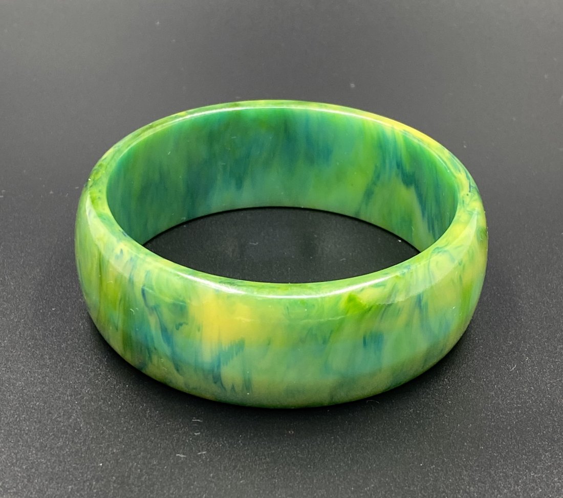 Bakelite Marbled Green Bangle: For exact dimensions please refer to the attached dimensions sheet. Bakelite was an early plastic resin, developed by Leo Baekeland in 1907. Originally used for industrial purposes thanks to its abili