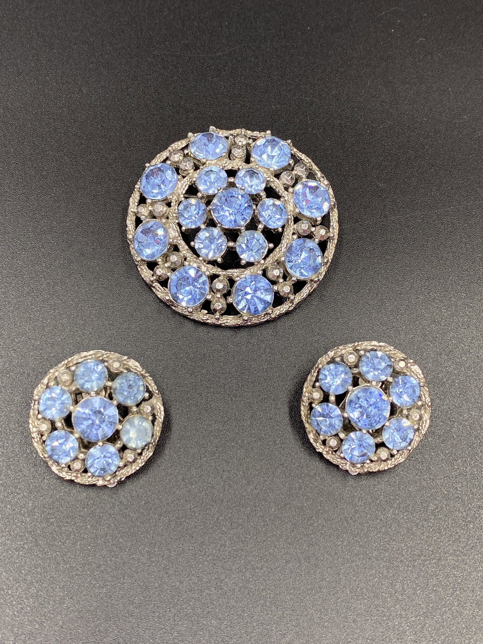 Weiss Brooch and Earrings: For exact dimensions please refer to the attached dimensions sheet. Signed Weiss.Before Albert Weiss founded his own costume-jewelry company in 1942, he learned the tricks of the trade as a designer f