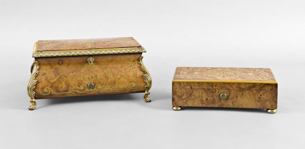 Two Reuge 3 air, 72 note music boxes: Music boxes- 2 (Two), both Reuge with 72 tooth combs, the first in a burl veneered, brass inlaid rectangular box on compressed ball feet, playing The Blue Danube, Lara's Theme, and Edelweiss, the othe