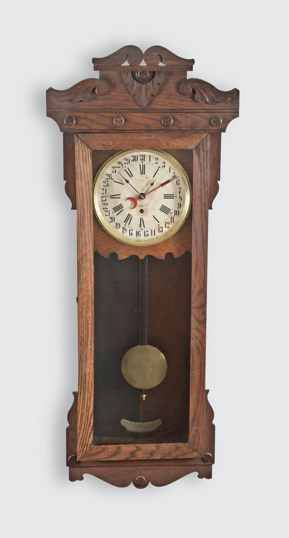 New Haven Clock Co., New Haven, Conn., "Rutland",: New Haven Clock Co., New Haven, Conn., "Rutland", calendar clock, in an oak case, paper on metal dial, spade hands, 8 day, spring driven brass movement. This model referred to as the "Rutland" was des