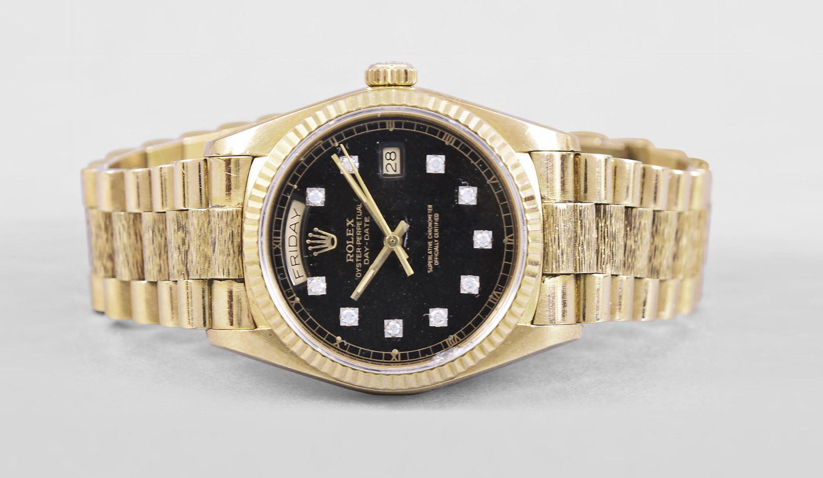 An 18 karat gold Rolex ref. 18038 President day date: Rolex Watch Co., Switzerland, an 18 karat yellow gold, ref. 18038 day date "President", cal. 3055, 27 jewels, automatic winding, adjusted to 5 positions and temperature nickel plate movement with leve
