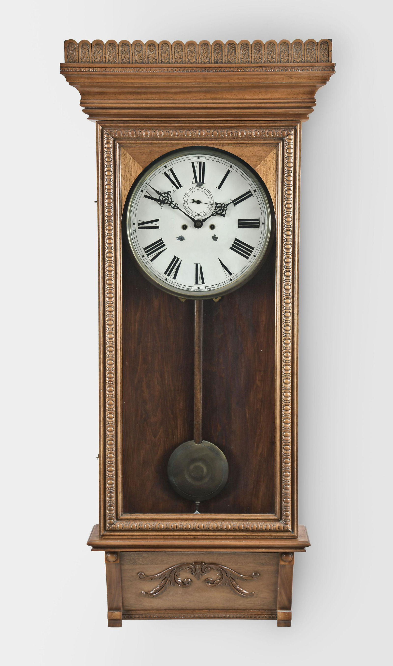 Waterbury Clock Co., Waterbury, Conn., "Regulator No.: Waterbury Clock Co., Waterbury, Conn., "Regulator No. 67", Wall timepiece, in a mahogany case, painted metal dial, 8 day, weight driven double wind brass movement