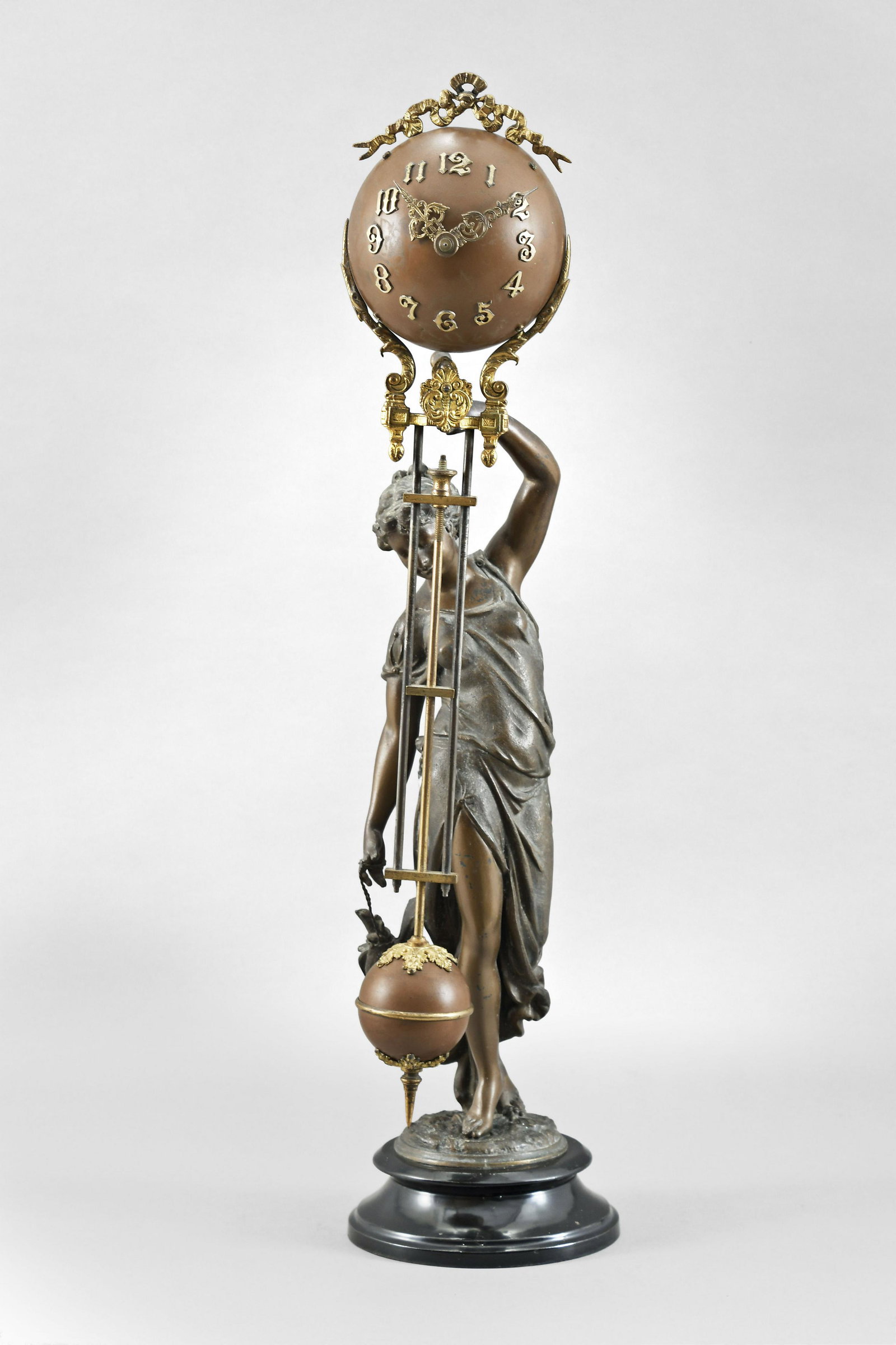 Ansonia Clock Co., New York, NY, "Huntress", swinger: Ansonia Clock Co., New York, NY, "Huntress", figural swinger mantel clock, cast spelter case, bronze finish metal ball dial, surpentine hands, 8 day, spring driven brass movement.