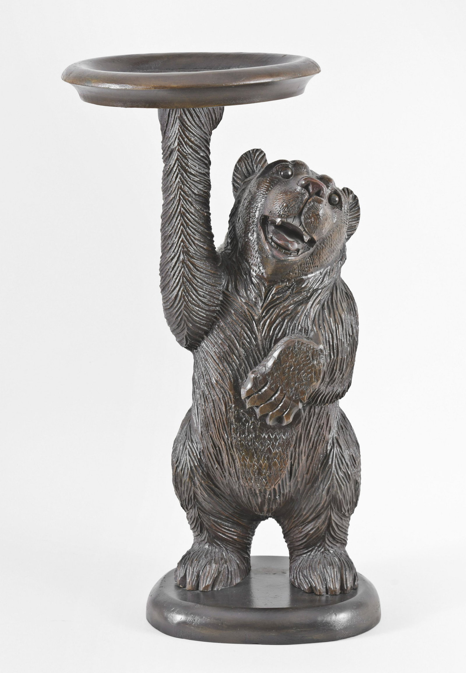 A 20th century Black Forest carved linden stand with (1 of 6)