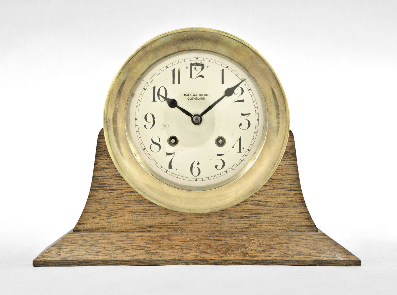 Chelsea Clock Co. Marine hanging ships clock for Ball: Chelsea Clock Co., Boston, Mass., "HOUSE STRIKE" wall marine cased clock with 8 day, time and strike Model M movement mounted on a custom mahogany stand. Polished brass case, spade hands, 5" silvered