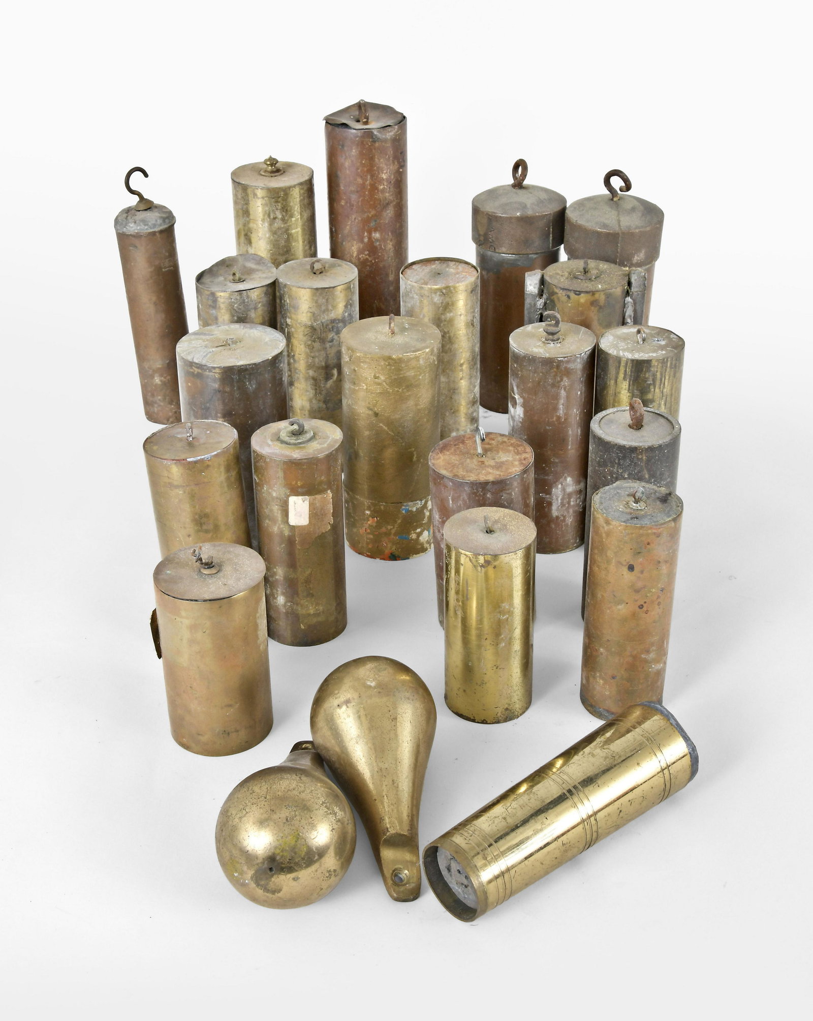 Twenty-three Brass Clock Weights: 23 (Twenty-three) brass clock weights, some of the period and European and several bench made