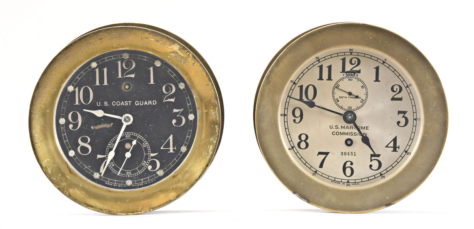 Two Seth Thomas Clock Co. brass marine wall clocks: 2 (Two) Seth Thomas Clock Co. brass case ships clocks with 8 day, time only spring driven movement and brass balance (1) "Ship's Lever No. 6", 5.5 in black painted metal dial inscribed "U.S. Coast Gua