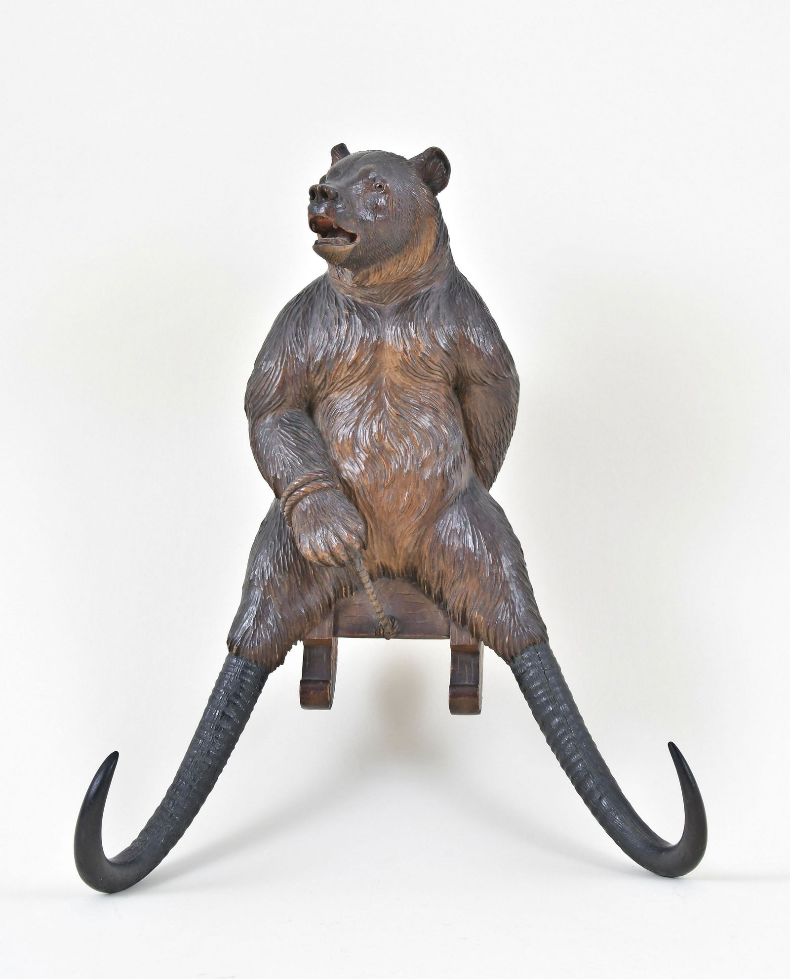 A whimsical Black Forest carved sledding bear crop hook (1 of 4)