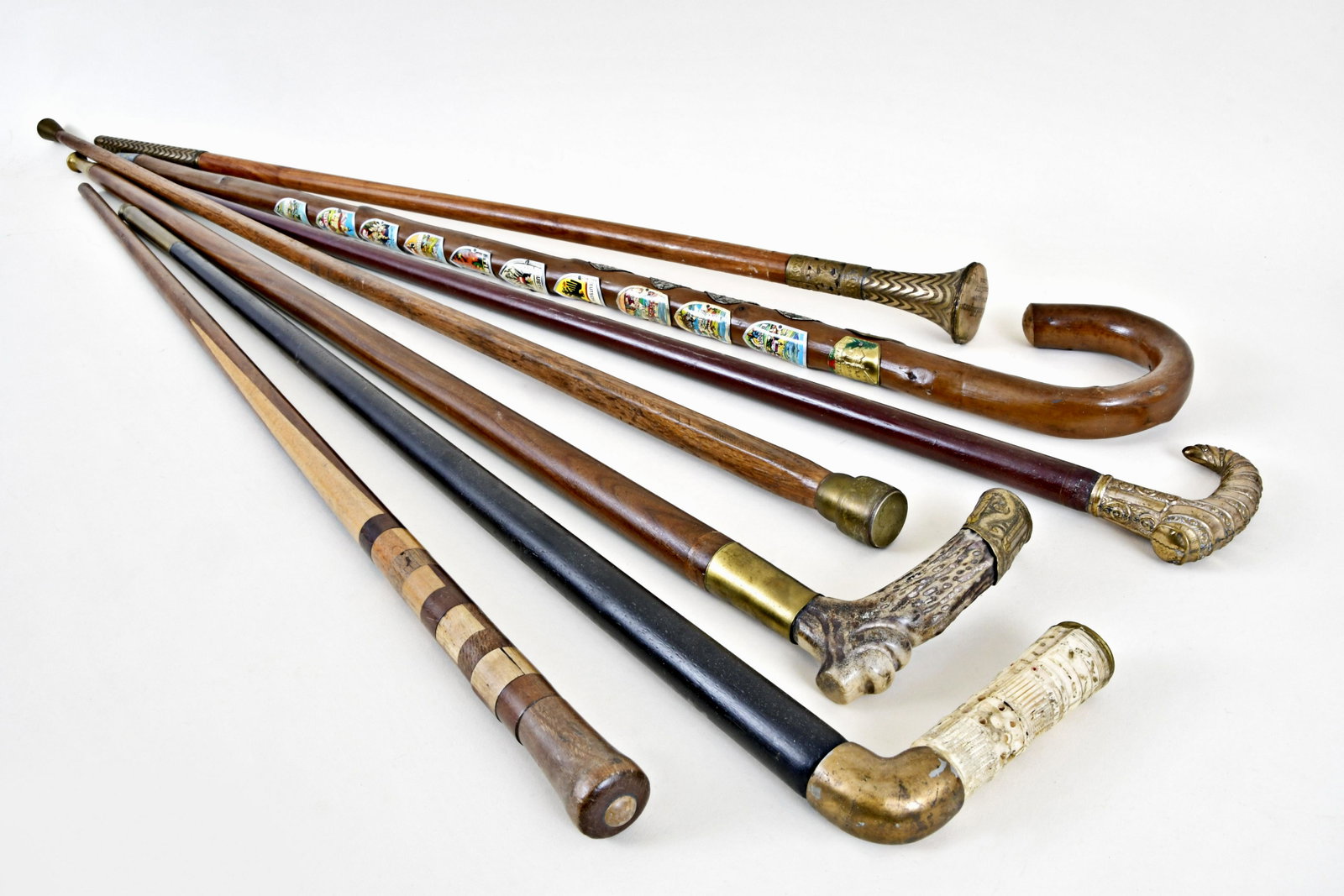 Lot of seven canes and walking sticks: 7 (Seven) canes and walking sticks, some with tropical hardwood shafts, the handles gold filled, antler, bone, and other materials, 32 - 37in.