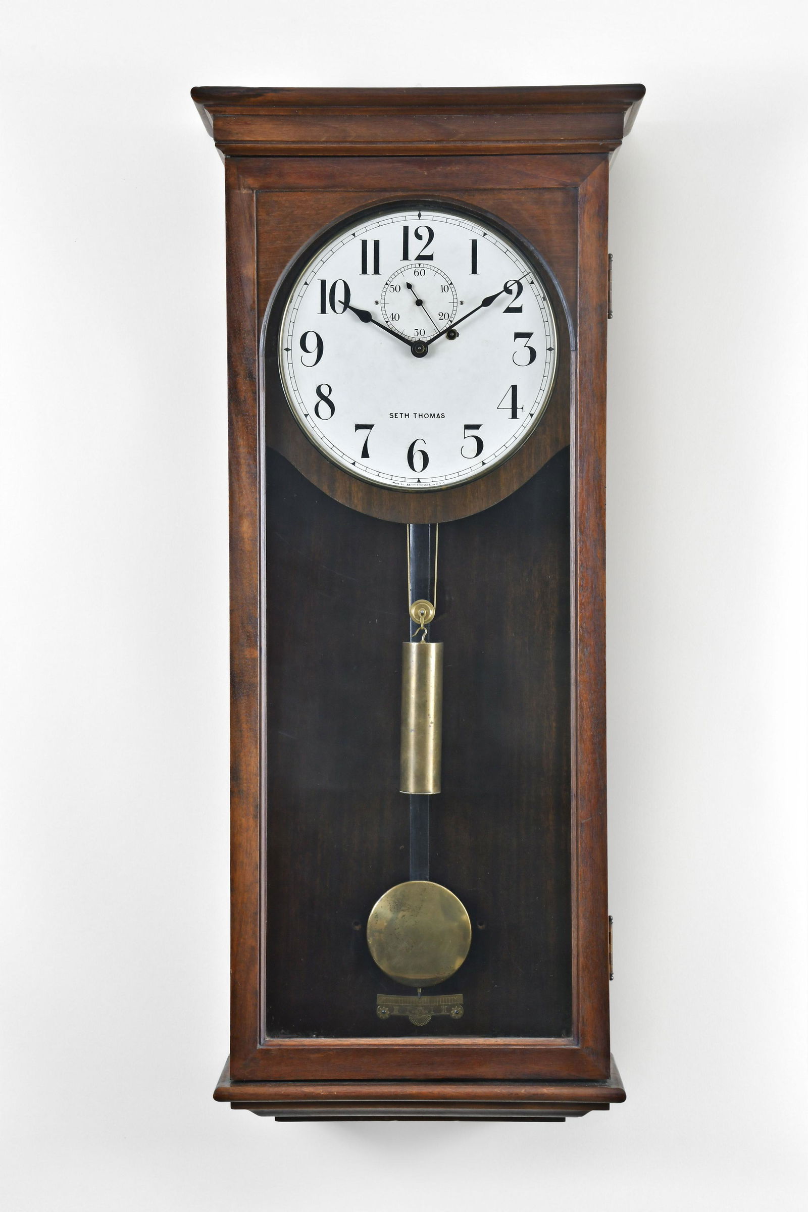 Seth Thomas Clock Co. Regulator No. 4 wall clock: Seth Thomas Clock Co., Thomaston, Conn., "Regulator No. 4", wall clock, Mahogany case, painted metal dial, spade hands, 8 day, weight driven brass movement.