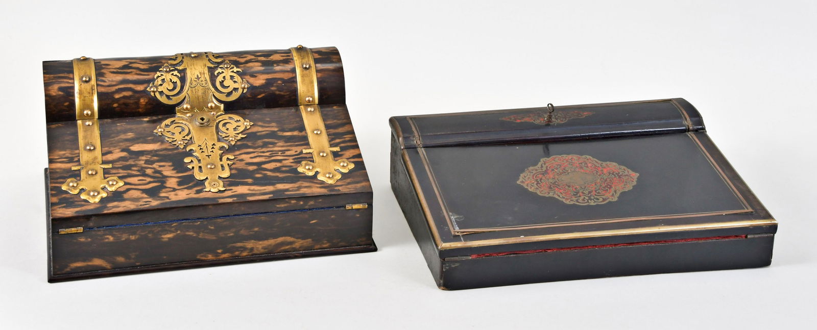 Two Traveling Writing Desks: 2 (Two) traveling writing desks one in coromandel with heavy brass strapping, two inkwells with gold washed tops, velvet writing surface, compartments for writing accessories with tops set with gold w