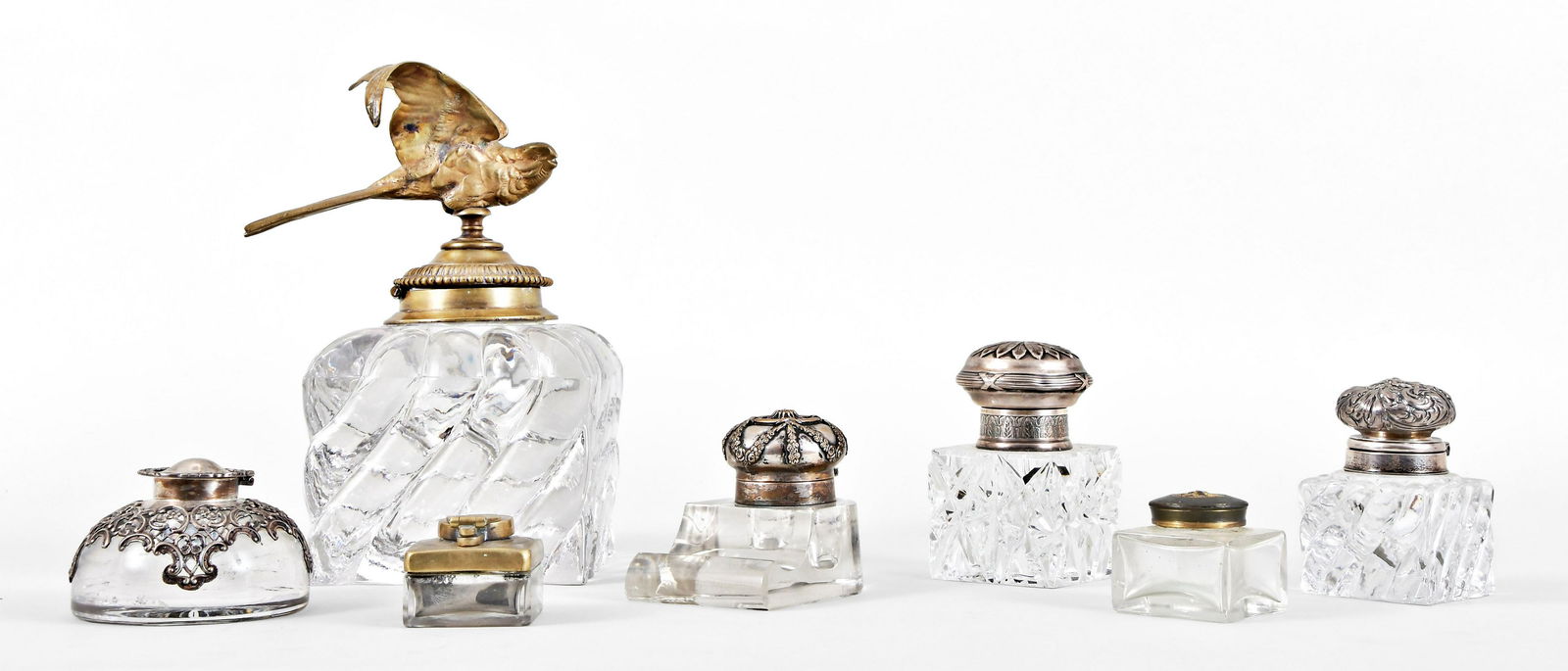 A lot of seven colorless glass inkwells (1 of 5)