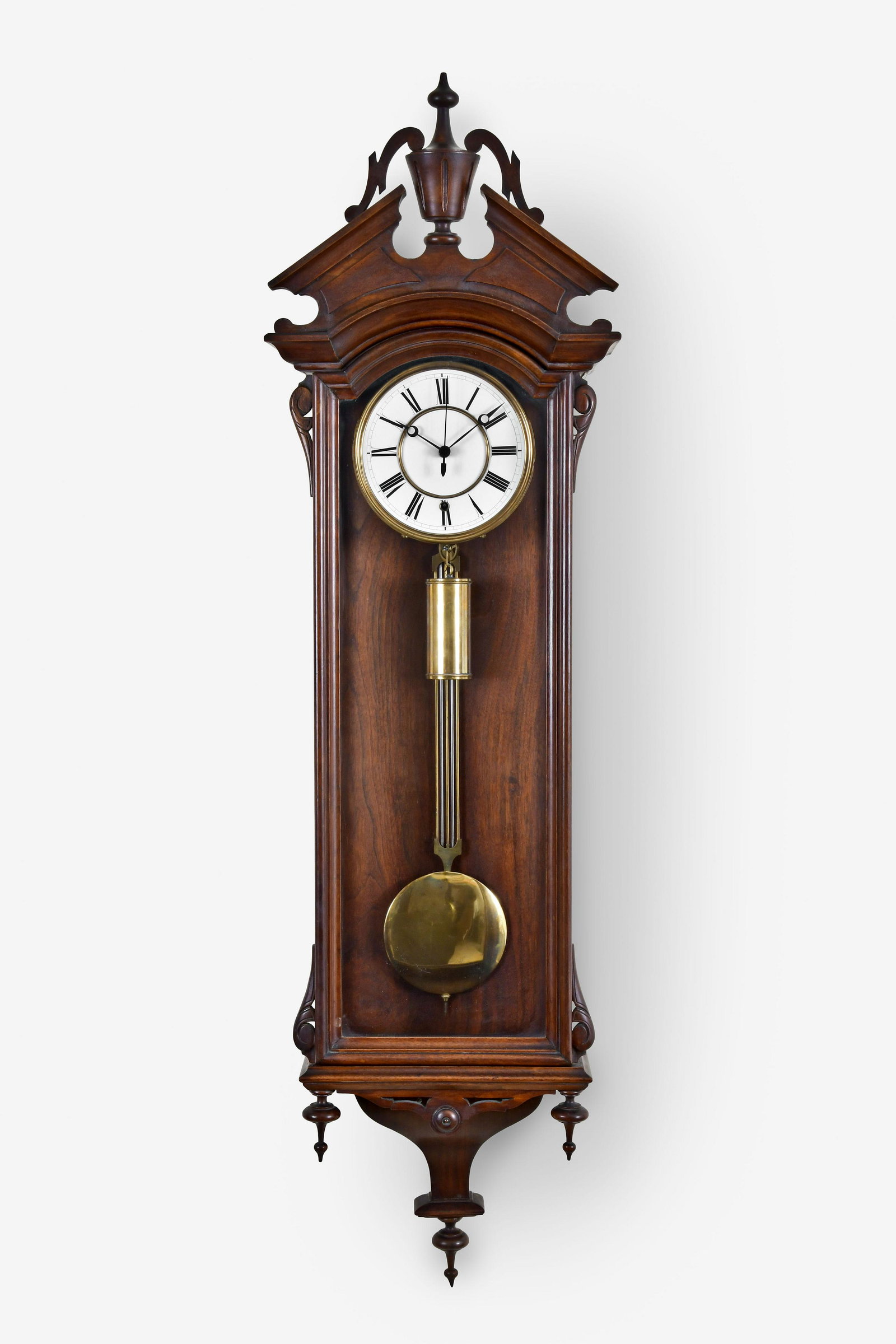 A late 19th century Vienna style hanging regulator by: George Jones, New York, a late 19th century Vienna style hanging regulator, walnut and walnut veneer case with ogee bottom bracket and turned drop, the molded bottom also with turned drops, molded doo