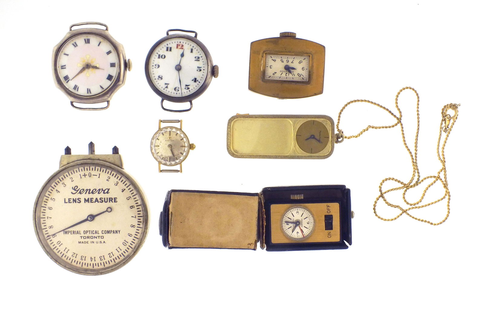 A lot of fourteen wrist watches, a small travel alarm and a Geneva lens measure (1 of 3)
