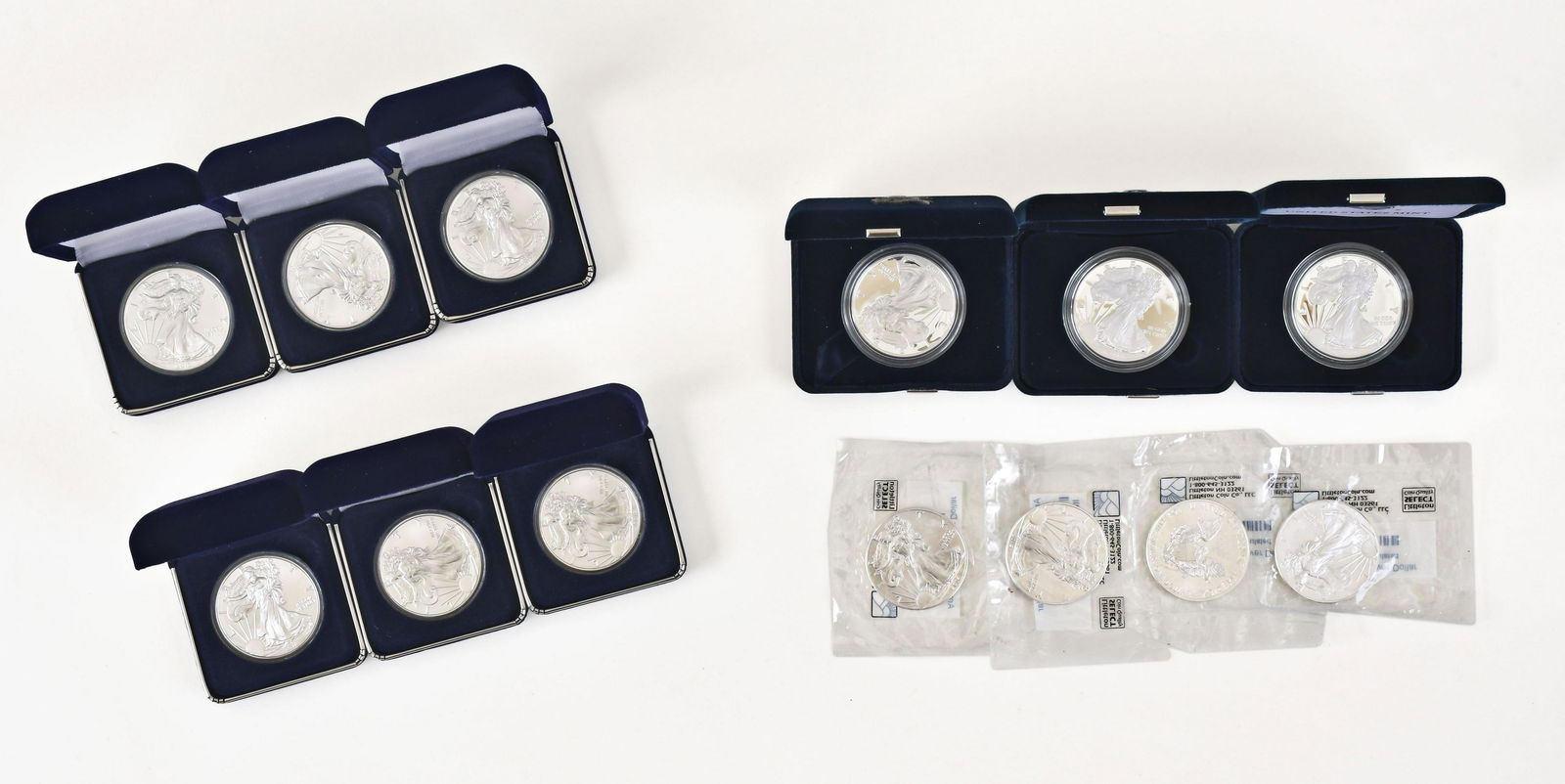 Thirteen American Eagle Silver Dollars: 13 (Thirteen) American Eagle silver dollars including three proof in cases, six mint in cases and four uncirculated in plastic