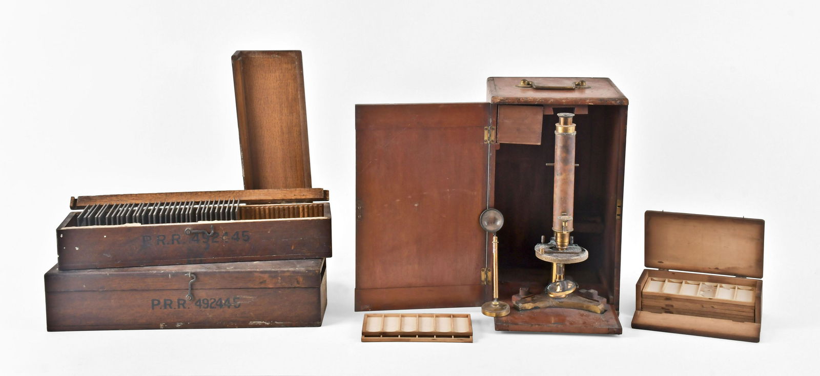 A Beck monocular microscope and two boxes of lantern slides illustrating valves (1 of 6)