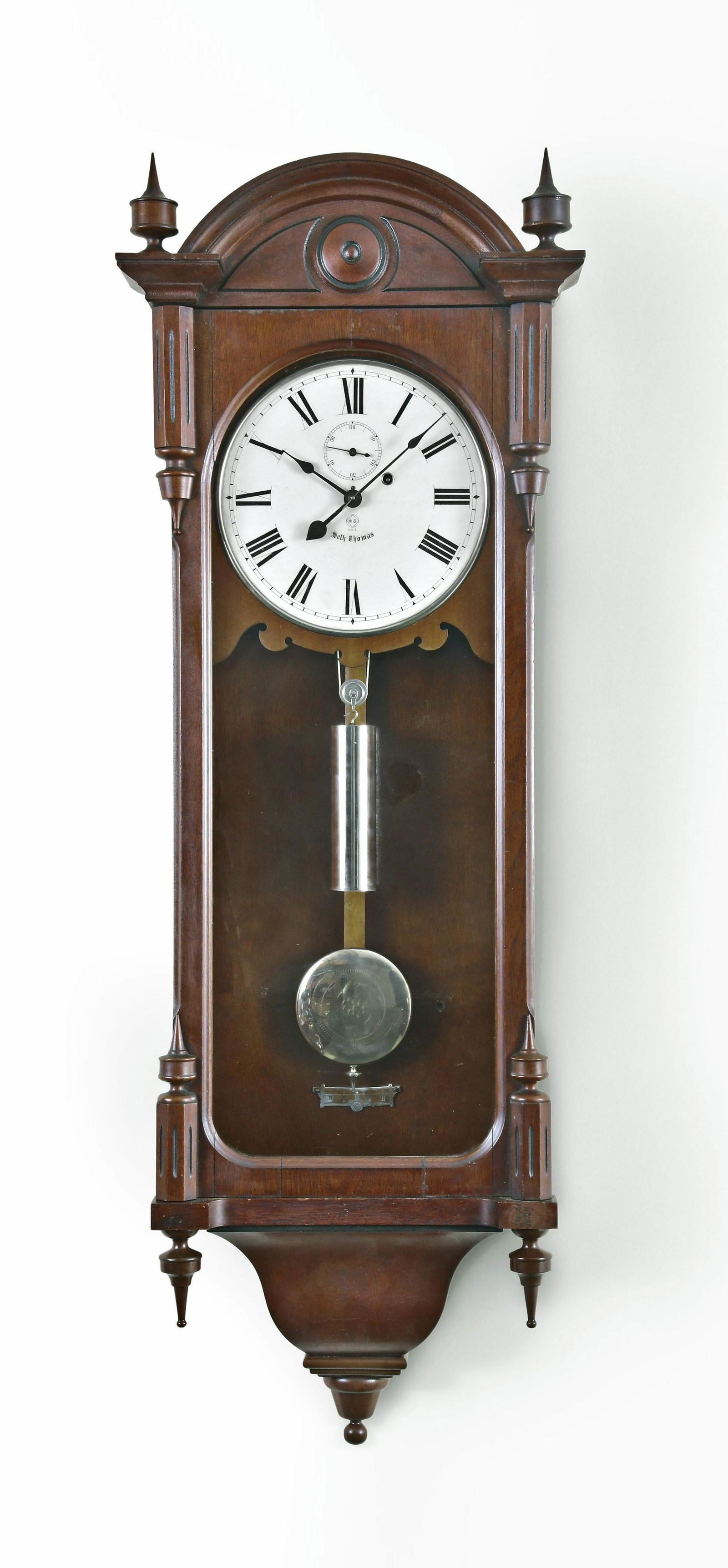 Seth Thomas Clock Co. Regulator No. 6 hanging clock: Seth Thomas Clock Co., Thomaston, Conn., "Regulator No. 6" hanging clock, walnut case, painted metal dial, spade hands, 8 day, weight driven brass movement with nickel damascened pendulum bob and nick