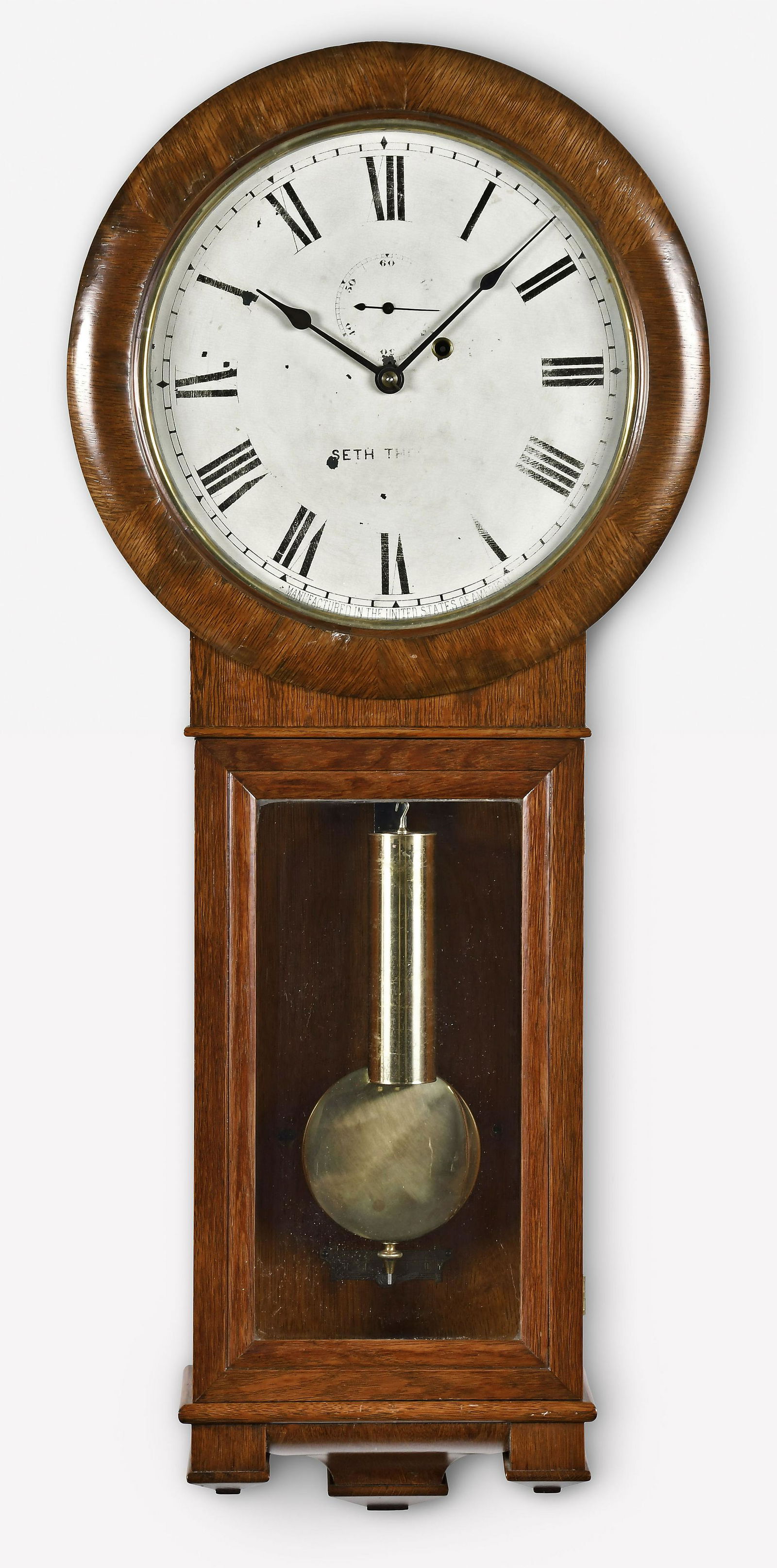 Seth Thomas Regulator No. 2 wall clock: Seth Thomas Clock Co., Thomaston, Conn., "Regulator No. 2" wall clock, oak veneered case, painted metal dial, spade hands, 8 day, weight driven brass movement.