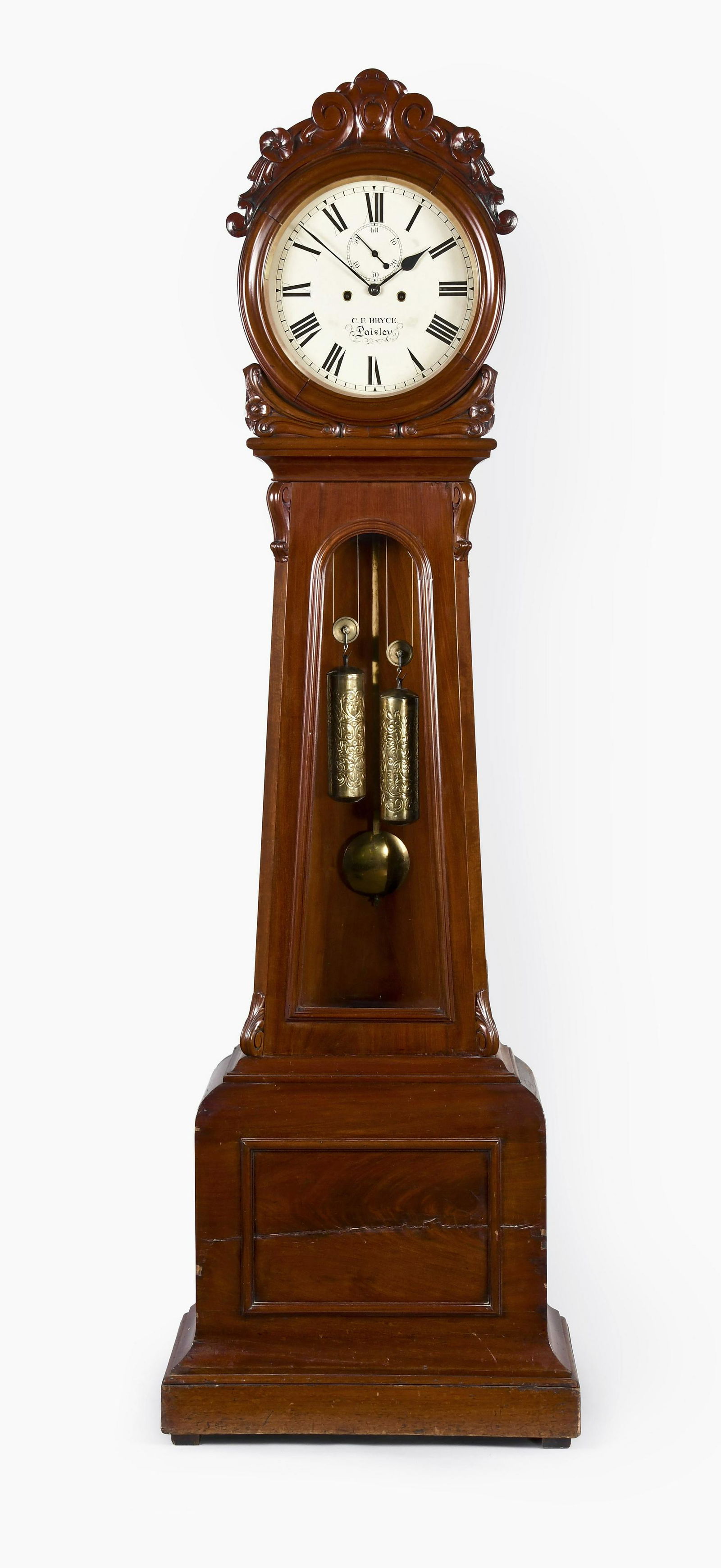Scottish drumhead tall clock: C.F. Bryce, Paisley, Scotland, drumhead tall clock in a mahogany case with crotch mahogany panel in base and carved surround on hood, glazed trunk door and sides, roman numeral round painted metal dia