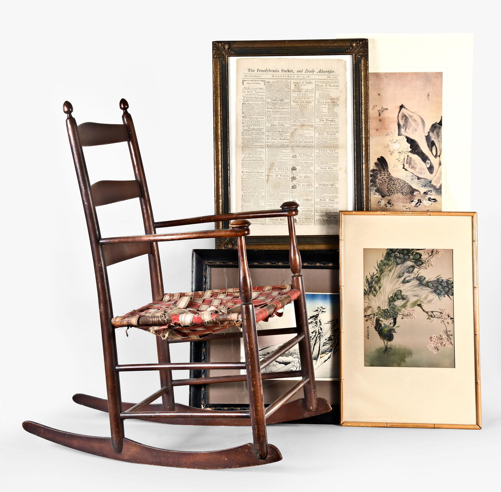 A lot including a Mt. Lebanon type Shaker rocking armchair and an 18th century newspaper: A lot of antiques and collectibles including a Mt. Lebanon Shaker type rocking armchair, back with three slats, the back of the upper stamped" 5", arms with turned hand holds, and the rear uprights wi