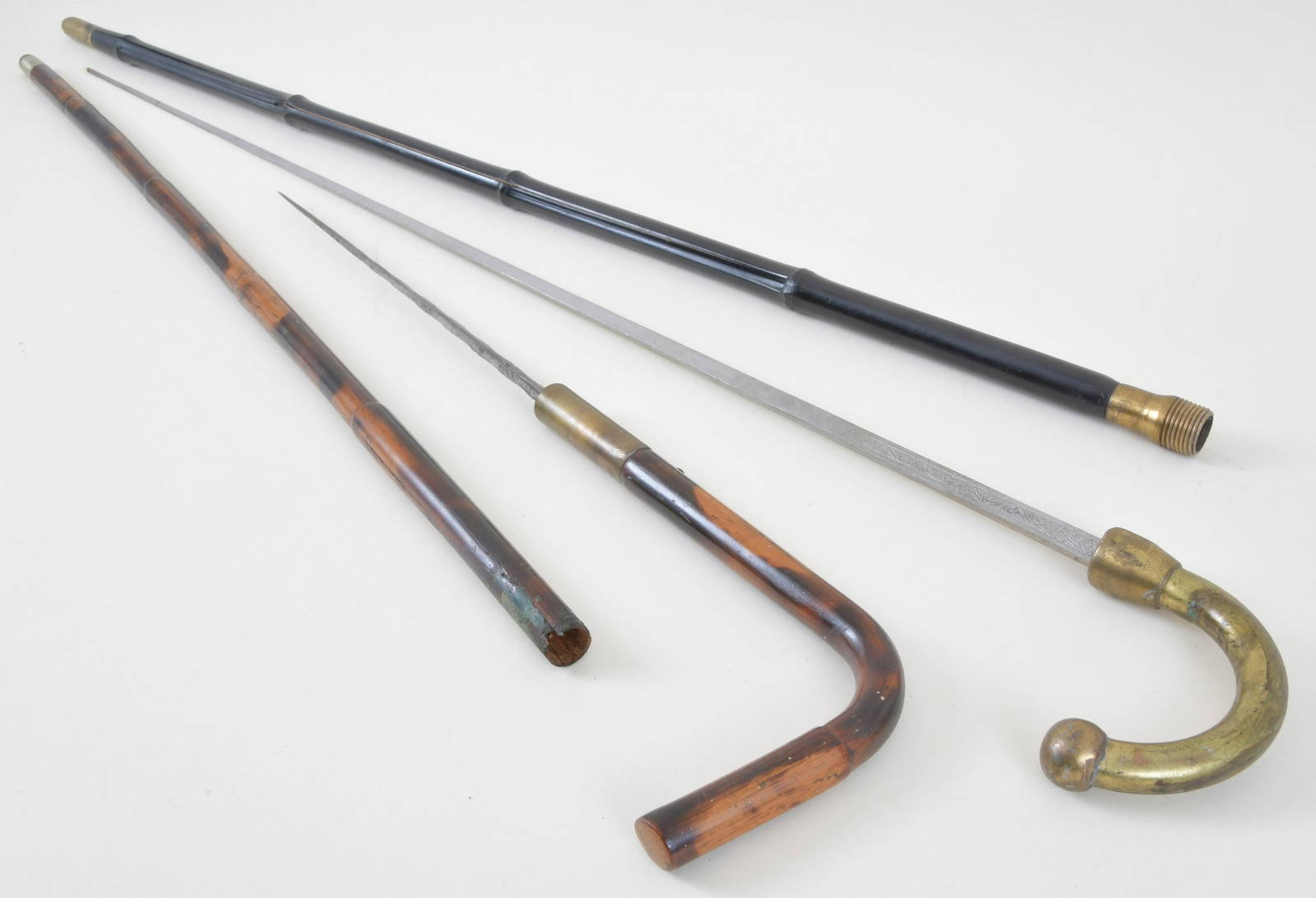 Lot Of Two Dagger And Sword Canes Auction