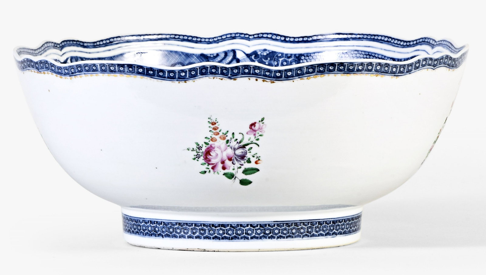 A good late 18th century Chinese export porcelain punch bowl for the American market: China, a good late 18th century export porcelain punch bowl for the American market, the exterior with blue bordered rim and foot, polychrome floral sprays, and shield shaped, monogrammed cartouches b