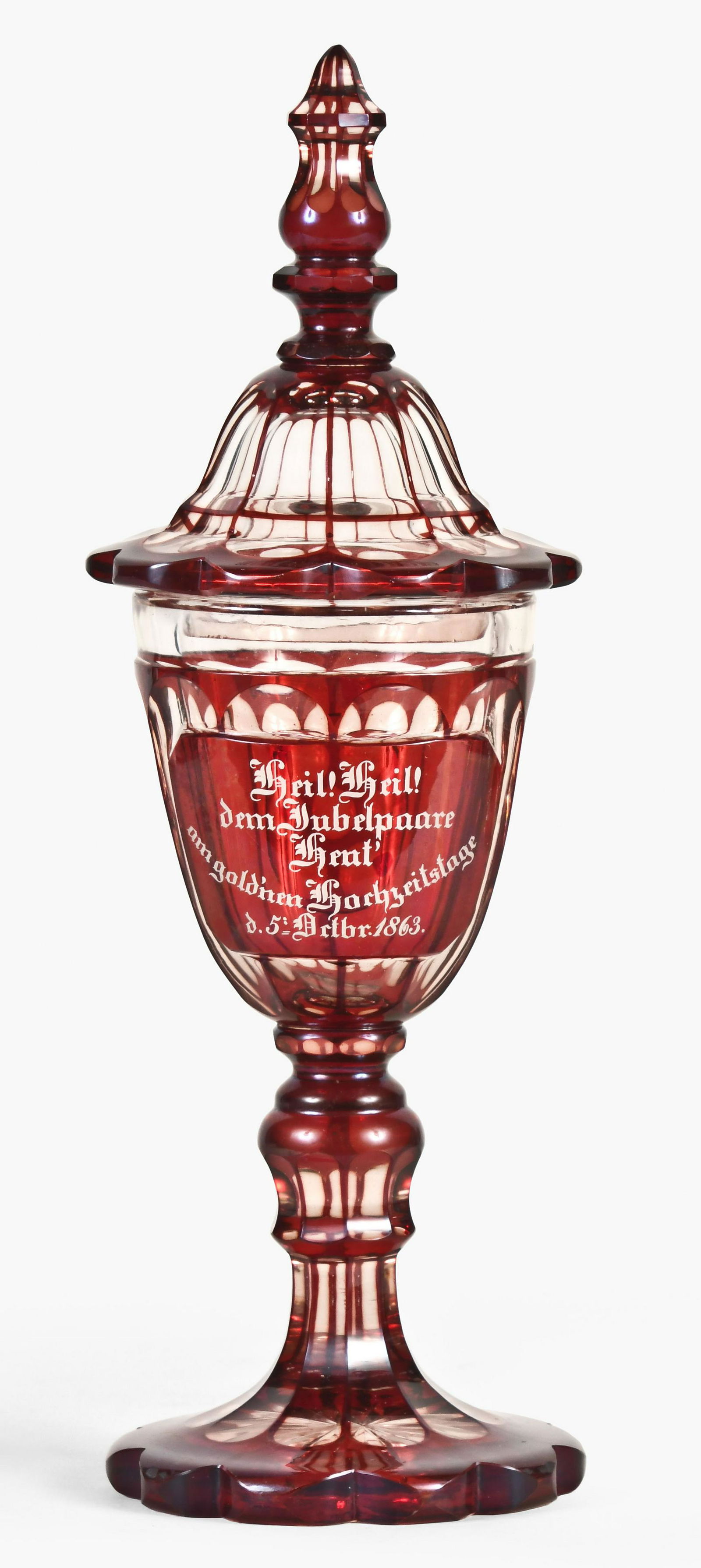 A good mid 19th century ruby Bohemian glass pokal: Bohemia/ Silesia, a good mid 19th century ruby Bohemian glass pokal, ten lobe, flat ground, polished base with cut star pattern, baluster form stem supporting the vasiform vessel, the cover with finis