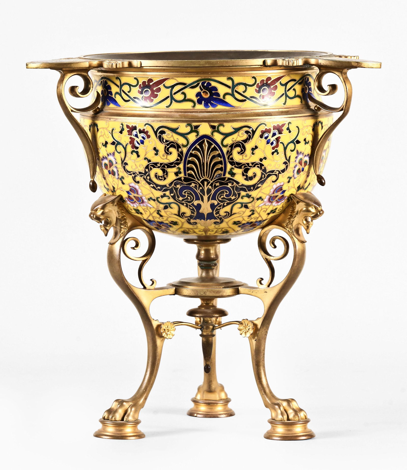A fine Napoleon III enameled tripod vase by Ferdinand Barbedienne: Ferdinand Barbedienne, Paris, a fine Napoleon III enameled tripod vase, with gilt bronze cabriole legs ending in paw feet resting on turned pads, the upper part of the leg with incurved scroll and fel